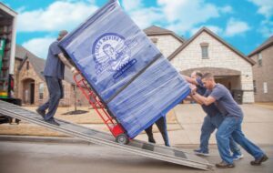arlington movers pushing dresser on moving truck